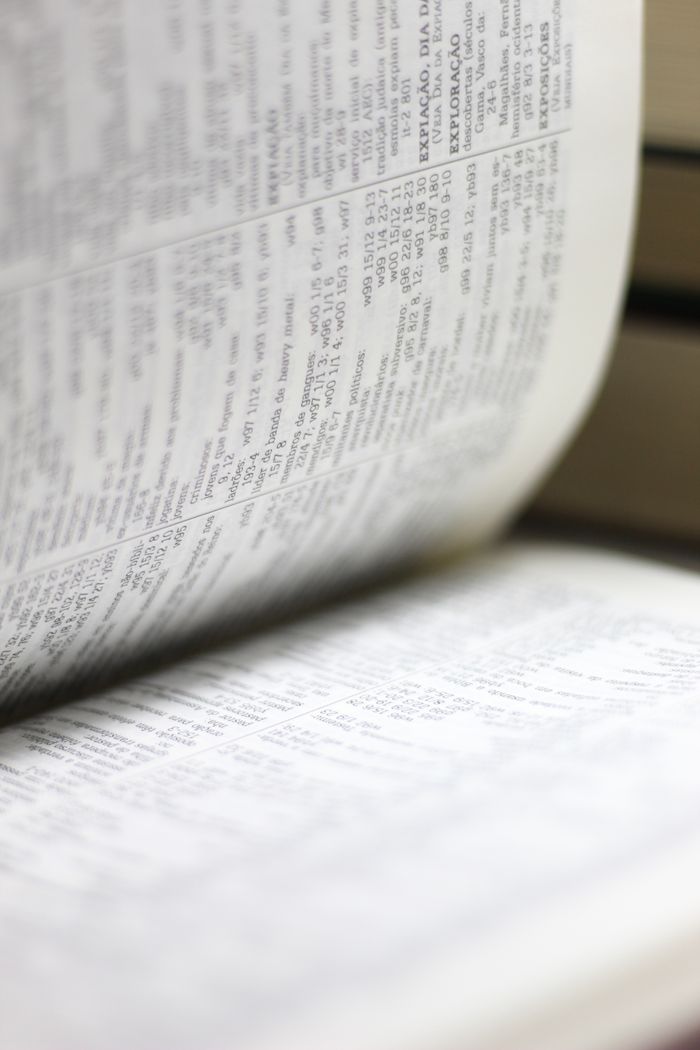 Home Close-up shot of an open book page, highlighting text details for educational themes.